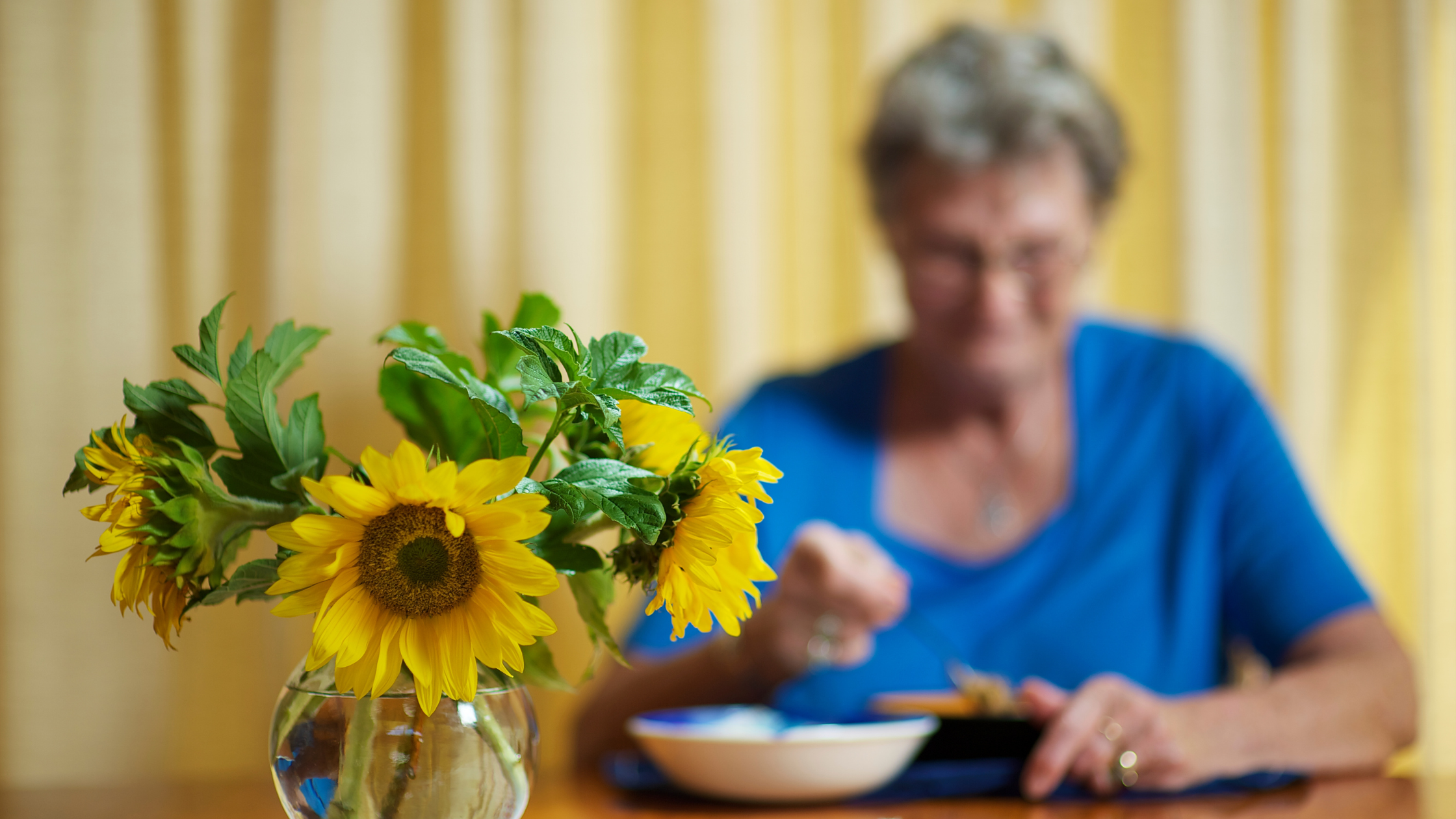 Senior lady with sunflower